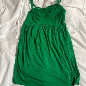 This is a green short flowy dress! It has a crisscross back and spaghetti straps